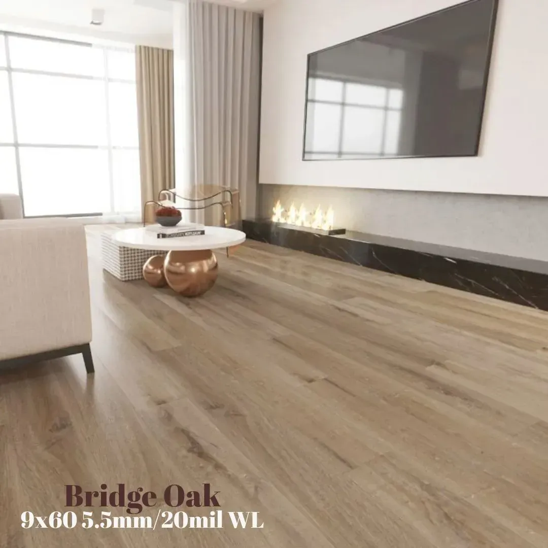 A modern living room featuring light brown wood-look flooring, a round coffee table, and a wall-mounted television.