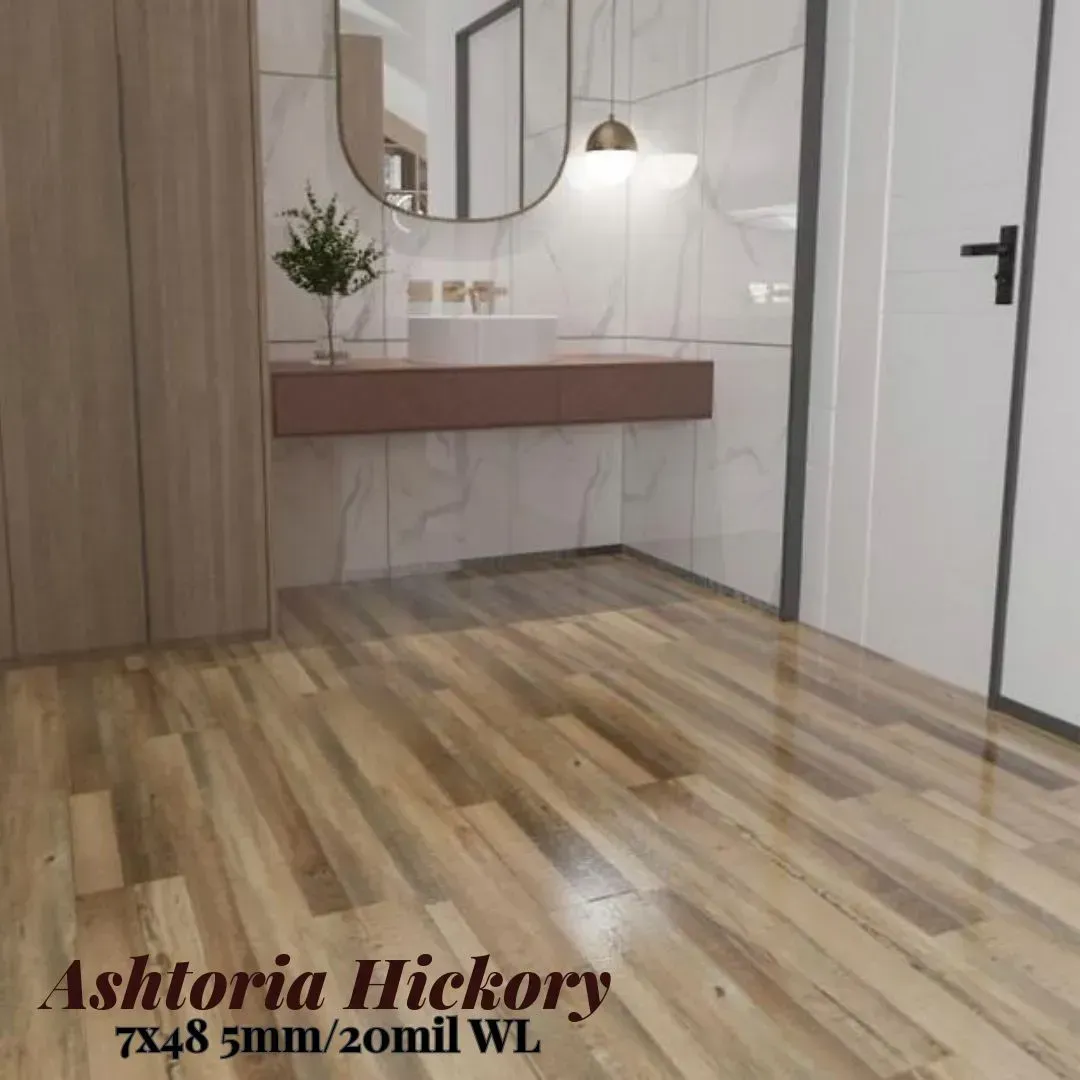 Wood-look flooring in a light brown hickory pattern shown in a modern bathroom with a vanity and white tiled walls.