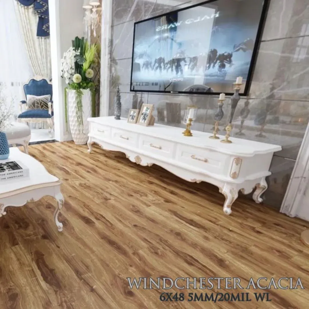 A modern living room with wood-look flooring, a white ornate media console, and a large wall-mounted television.