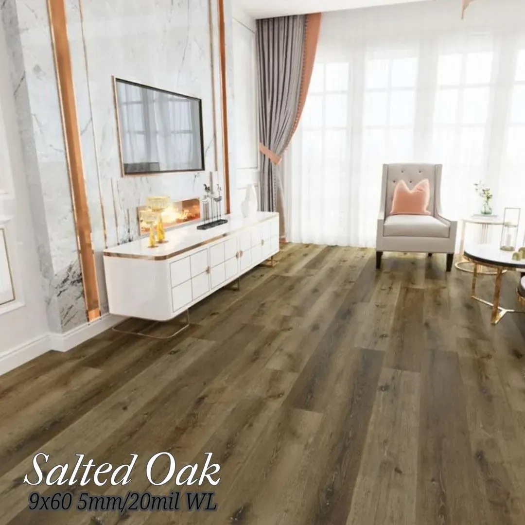 A bright living room features light brown Salted Oak wood flooring, a white media console, and a cozy accent chair.