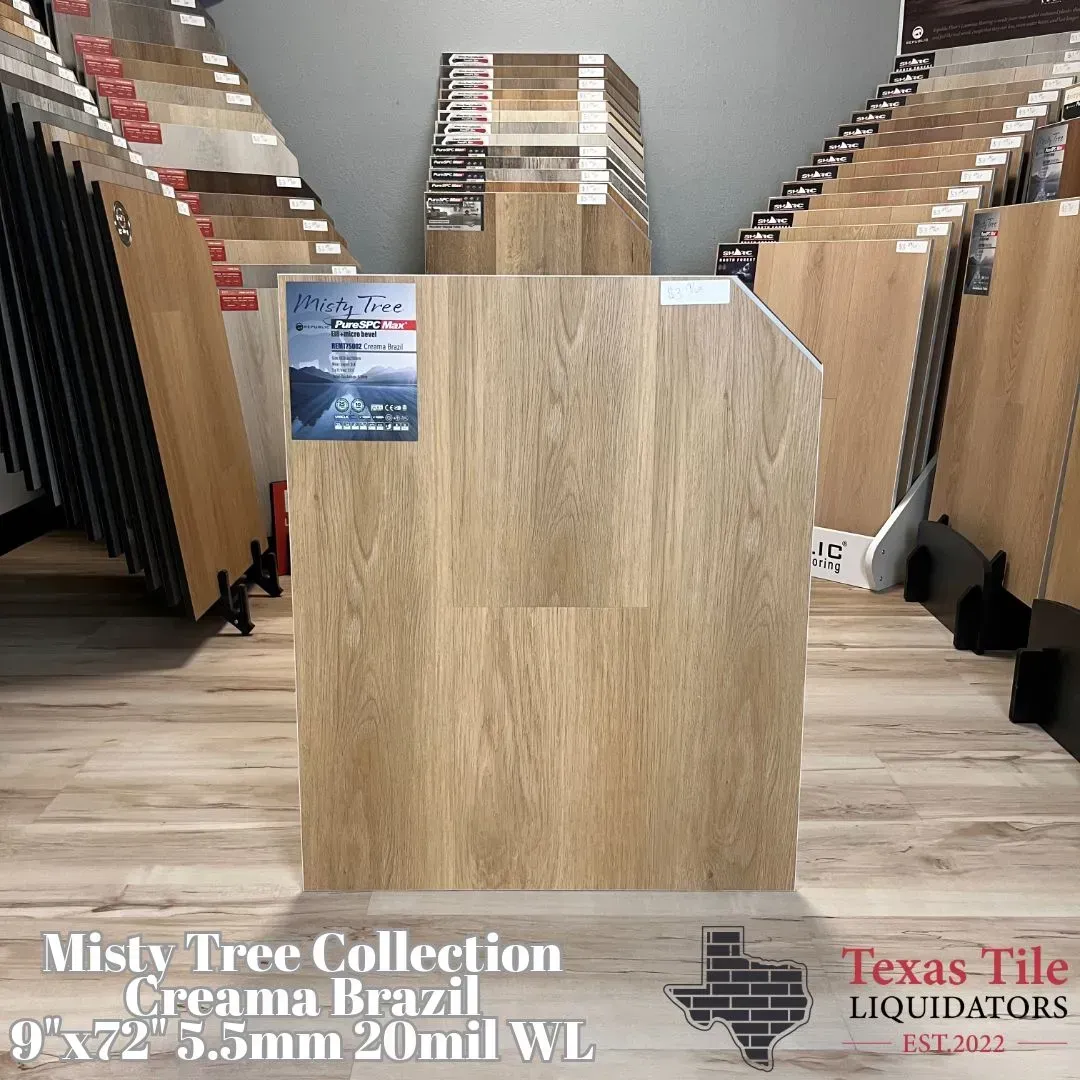 A display board of light oak-colored wood flooring in a showroom, labeled Misty Tree Collection Creama-Brazil.