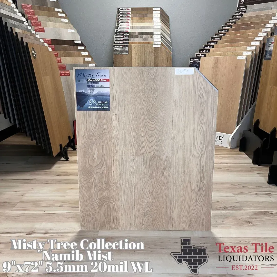 Empty wood display podium centered in a flooring showroom, with sample racks and Texas Tile Liquidation signage.