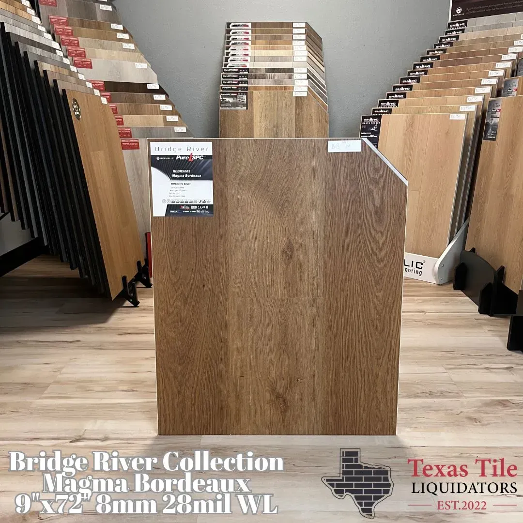 A display of Bridge River Collection Magma Bordeaux luxury vinyl flooring at Texas Tile Liquidators.
