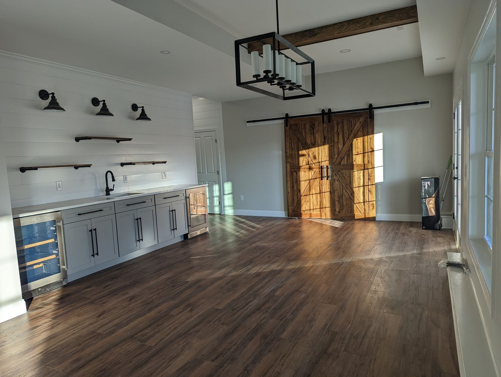 There is a sliding barn door in the middle of the room.