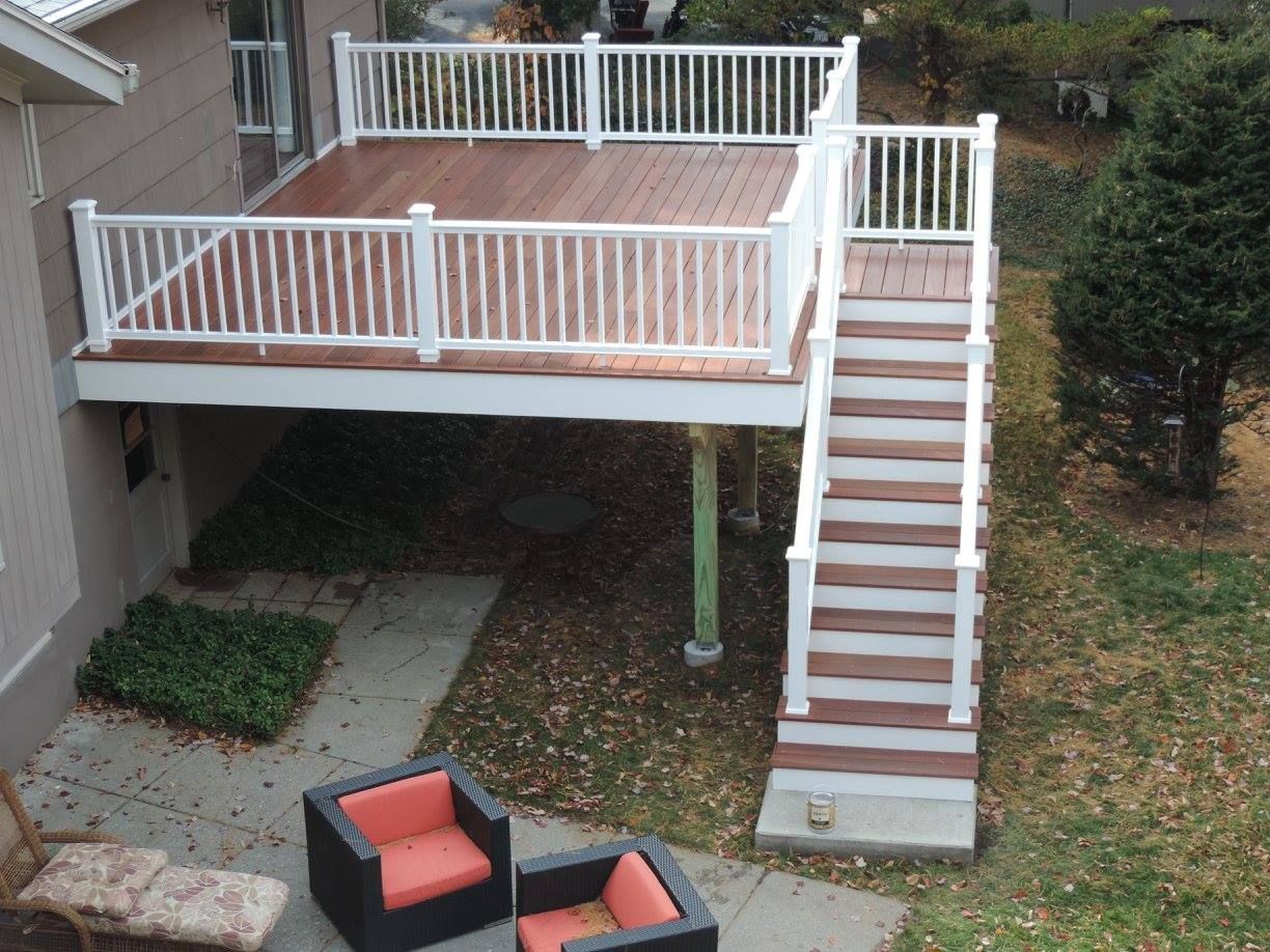 A large deck with stairs leading up to it.