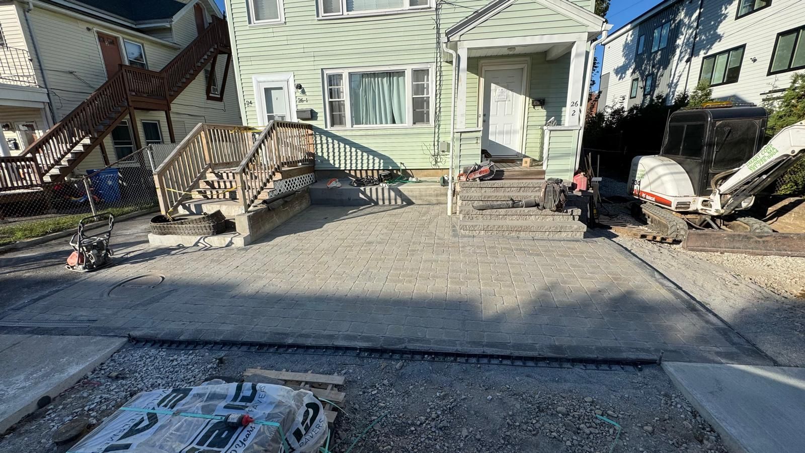 Green house with wood stairs 