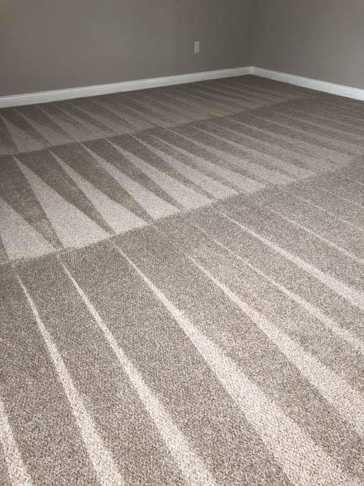 A room with a carpeted floor and a striped pattern on it.