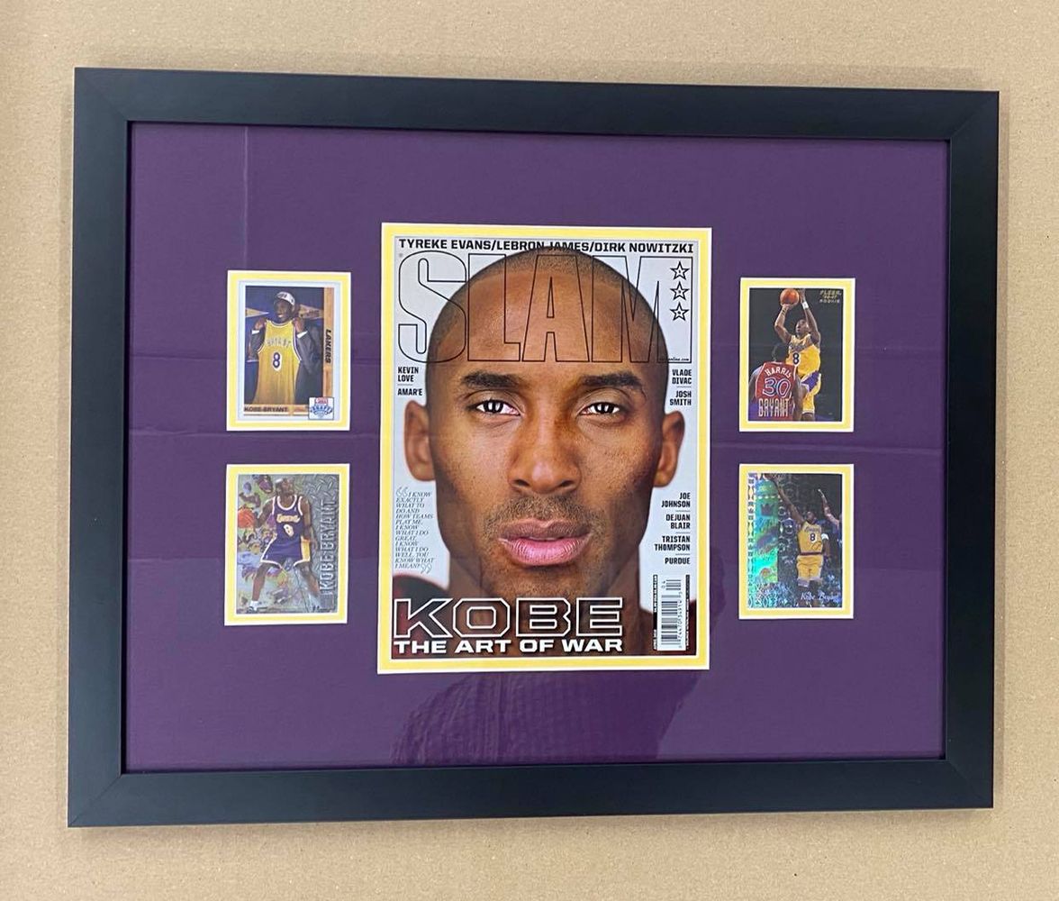 A framed picture of kobe bryant on the cover of slam magazine