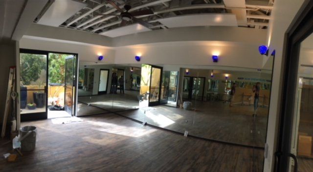 A large room with a lot of mirrors on the wall