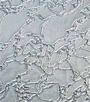 A close up of a stained glass window with a swirl pattern.