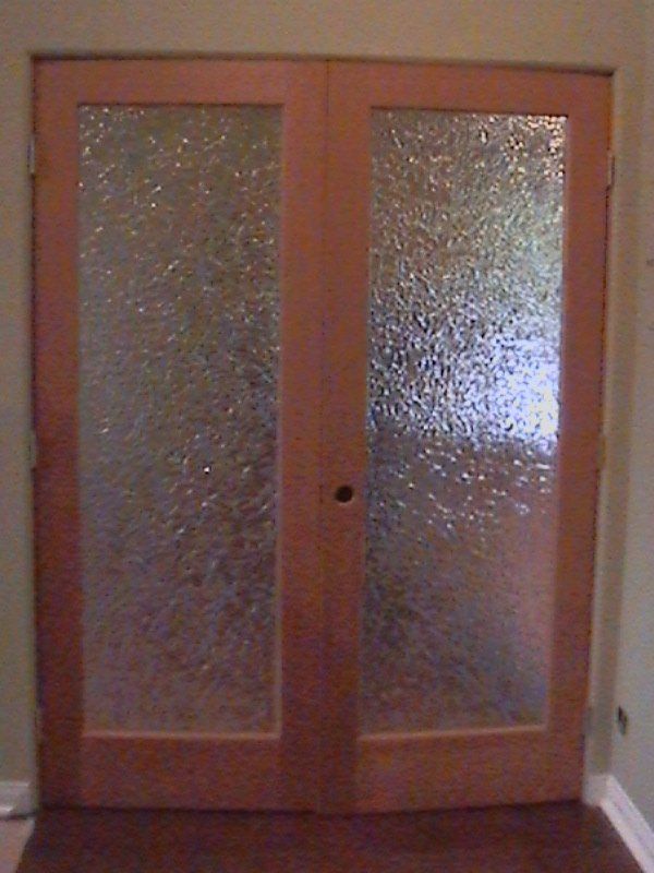 A pair of sliding glass doors in a room