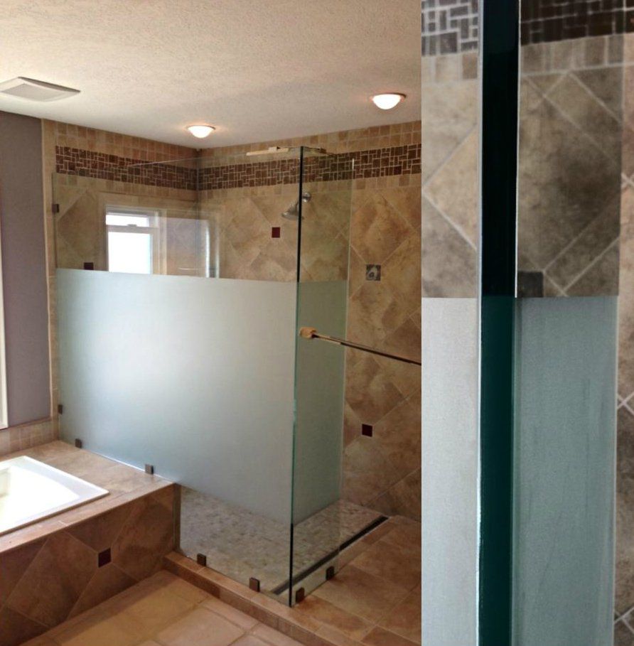 A bathroom with a walk in shower and a bathtub