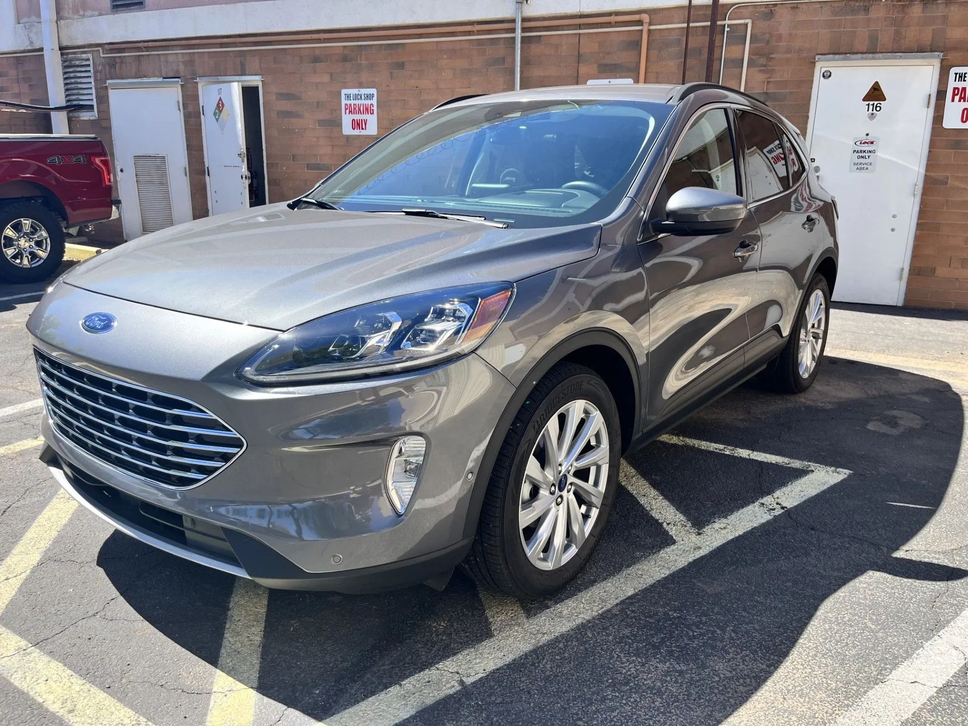 Gray Ford Escape SUV parked in a parking spot.