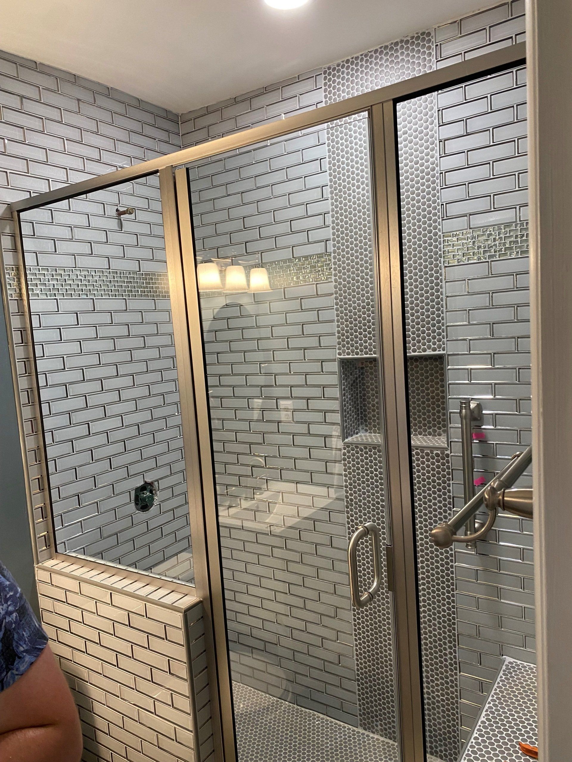Shower white tile and glass doors