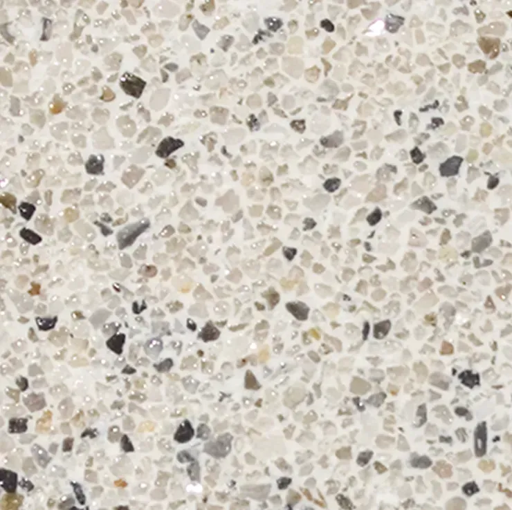 Close-up of a speckled beige, white, and gray speckled stone surface.