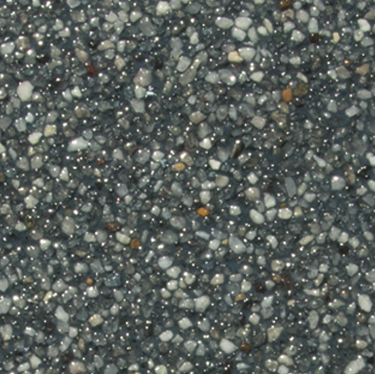 Textured surface of small, shiny gray and white pebbles.