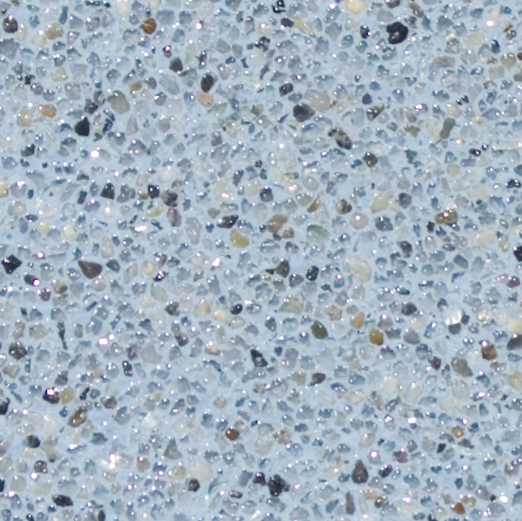 Textured light blue surface with small, speckled stones, some reflecting light.