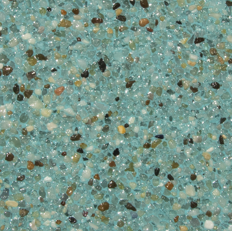 Close-up of a textured turquoise pool surface with small, embedded pebbles in shades of brown, black, and tan.