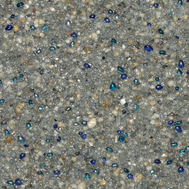 Close-up of a speckled pool surface; predominantly gray, with scattered blue and white pebble-like inclusions.