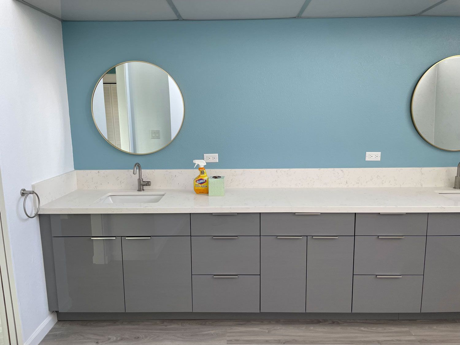 A bathroom with two sinks and two mirrors.