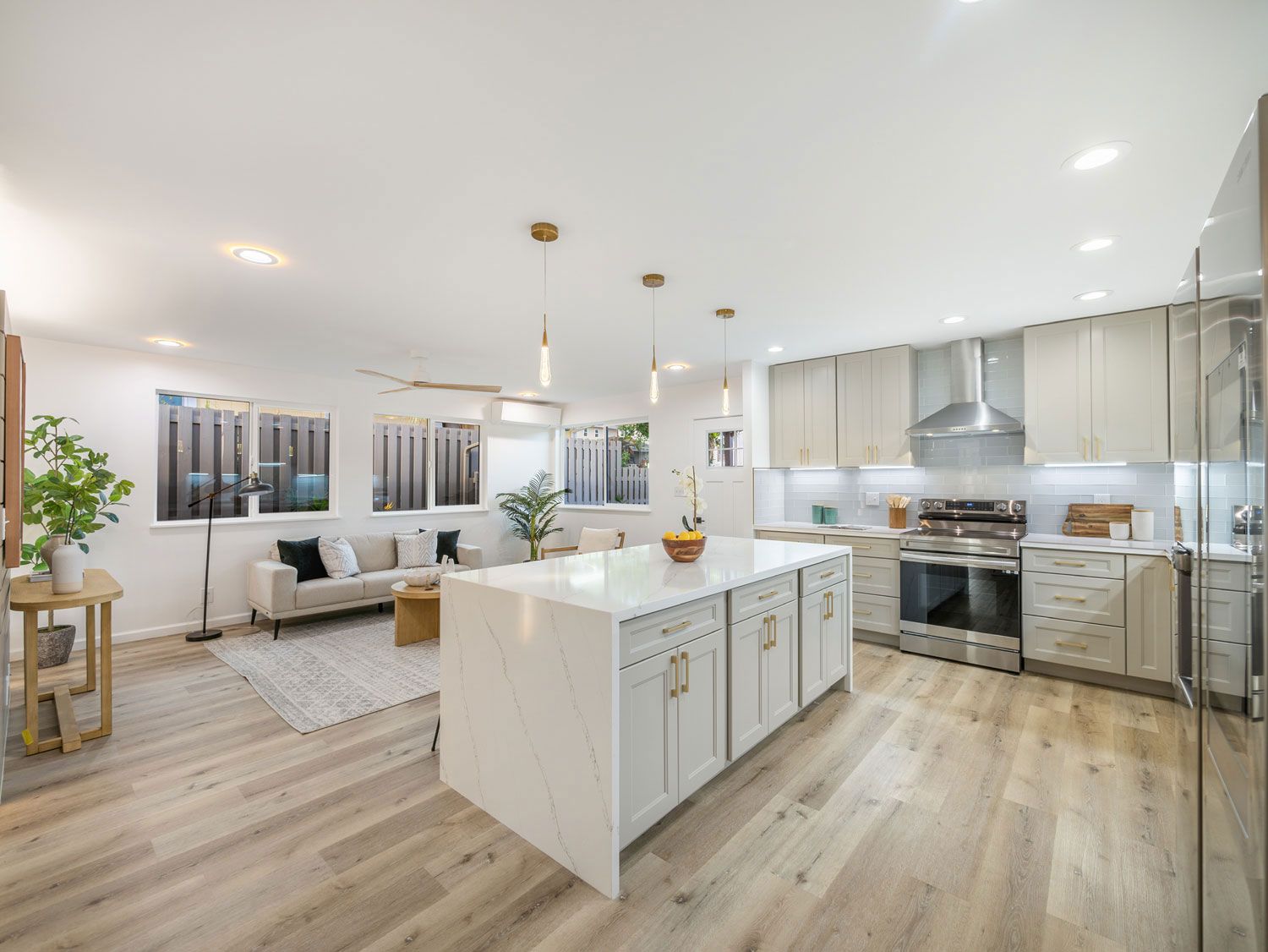 A kitchen with a large island in the middle of the room.