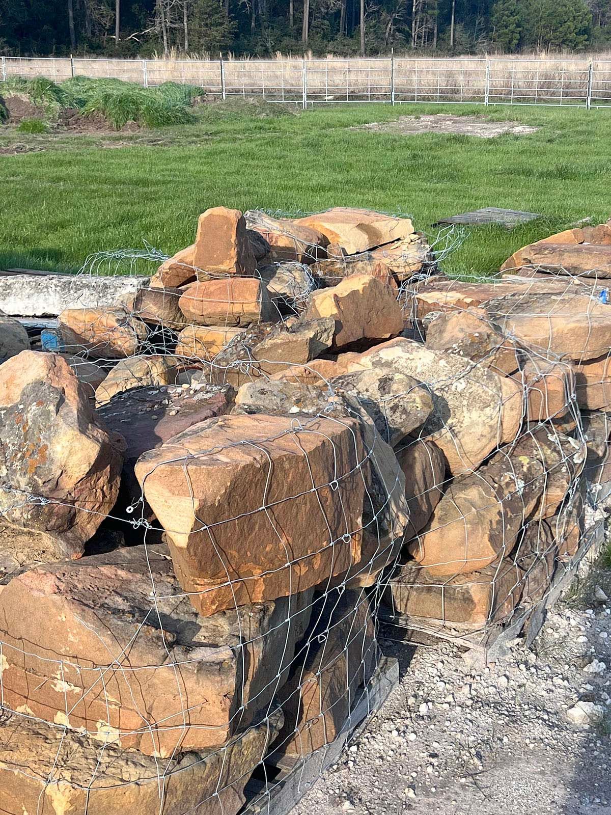 Boulders sitting on top of each other in a field