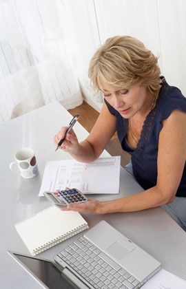 Woman holding a calculator