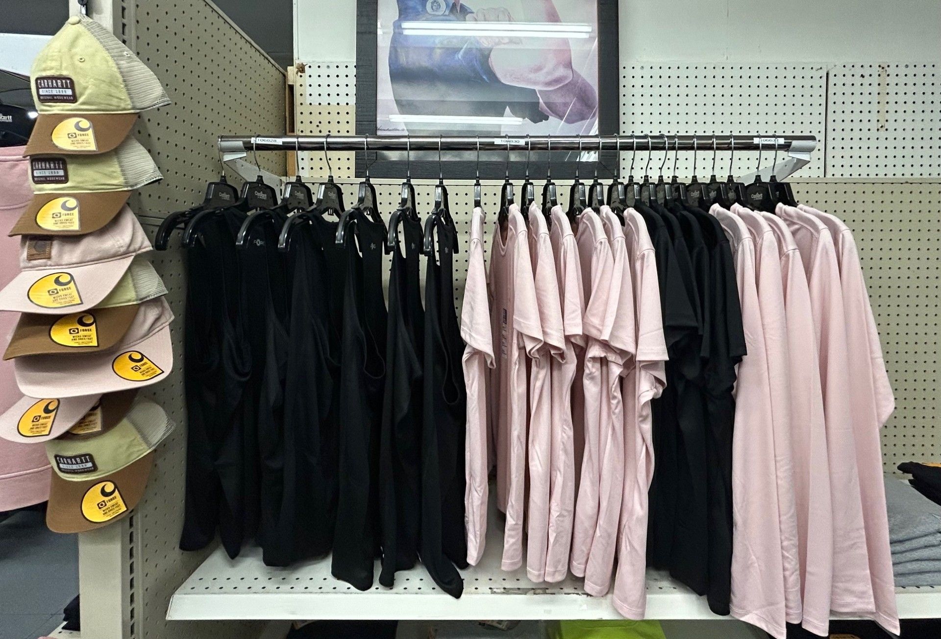 A display of shirts and hats in a store