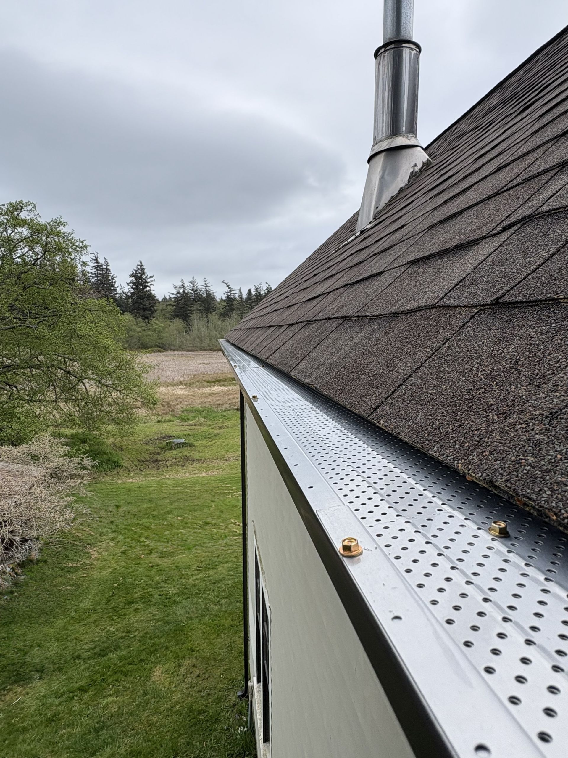 Gutter Covers Installed along roof edge to keep leaves and debris out of the gutters