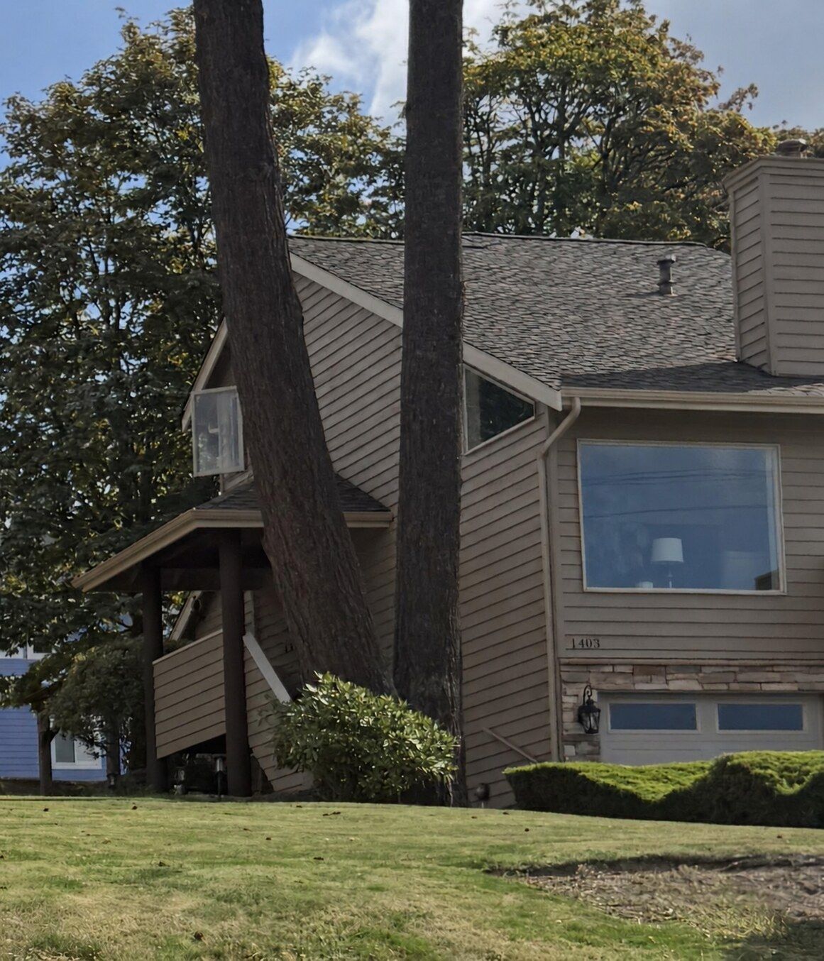Ivory seamless gutters and gutter covers installed on a freshly painted home in Bellingham, WA 