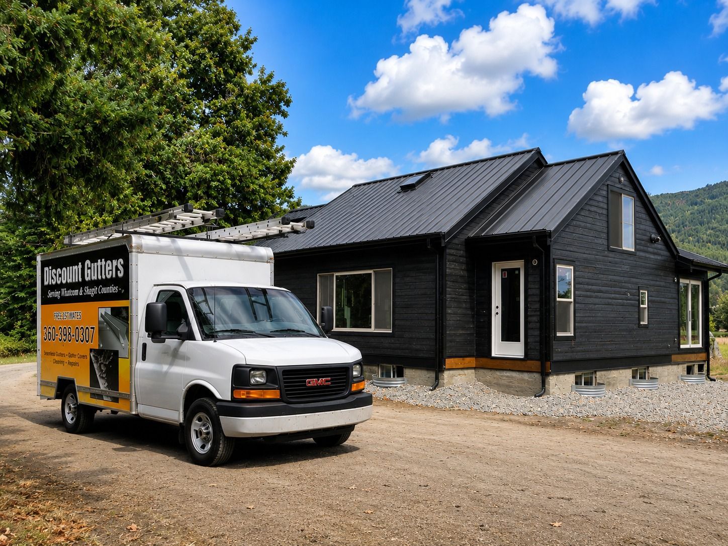 Discount Gutters truck at remodeled Everson WA home with black gutters, downspouts and gutter covers