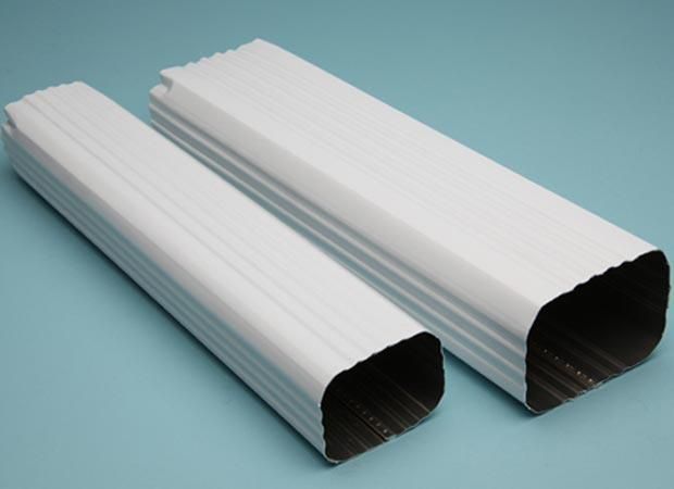 Two white corrugated plastic tubes on a light blue background