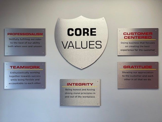 A shield with the words core values on it