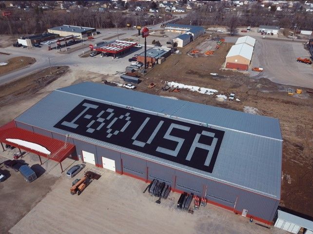 An aerial view of a building with solar panels