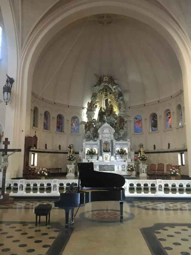 A piano is sitting in the middle of a church