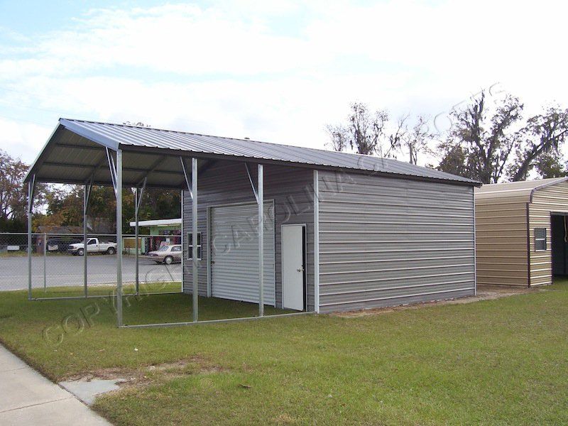 A metal building with a canopy on top of it.