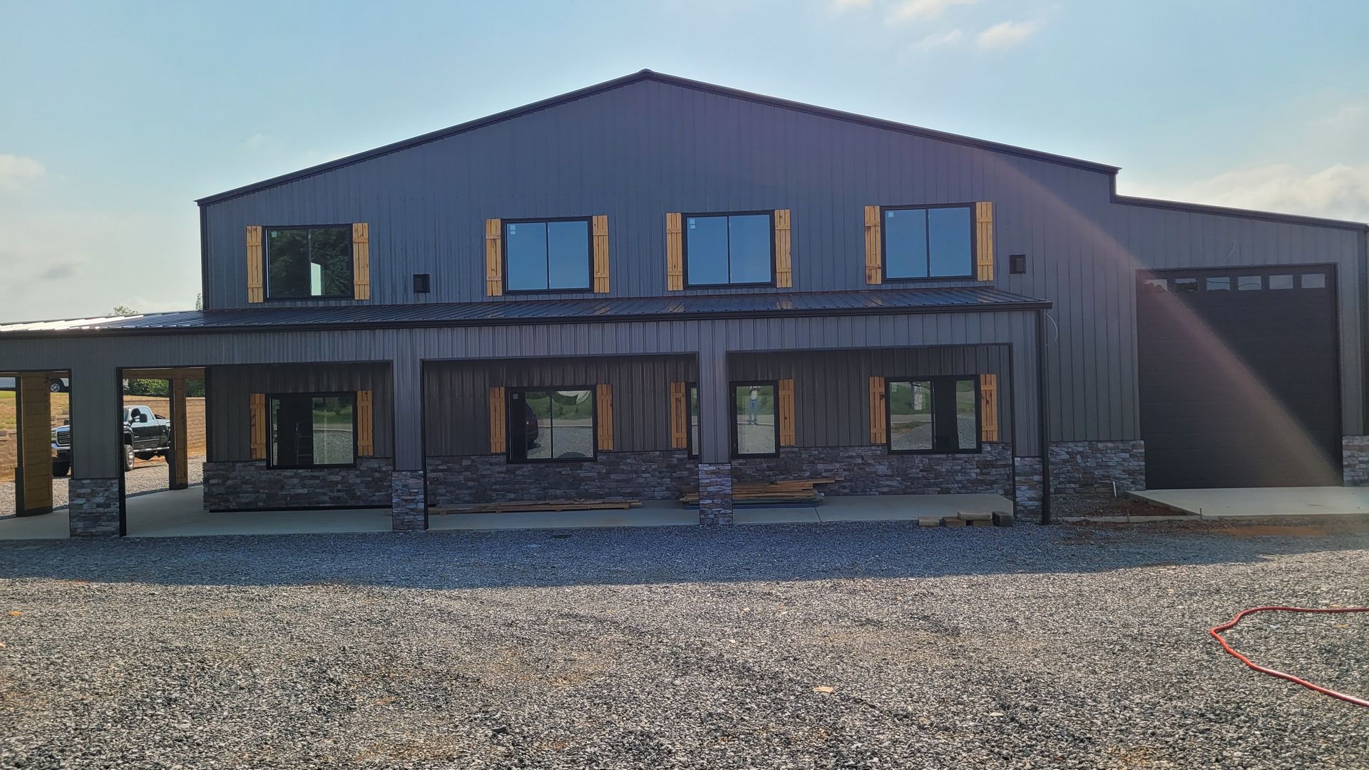 A large building with a lot of windows and a garage