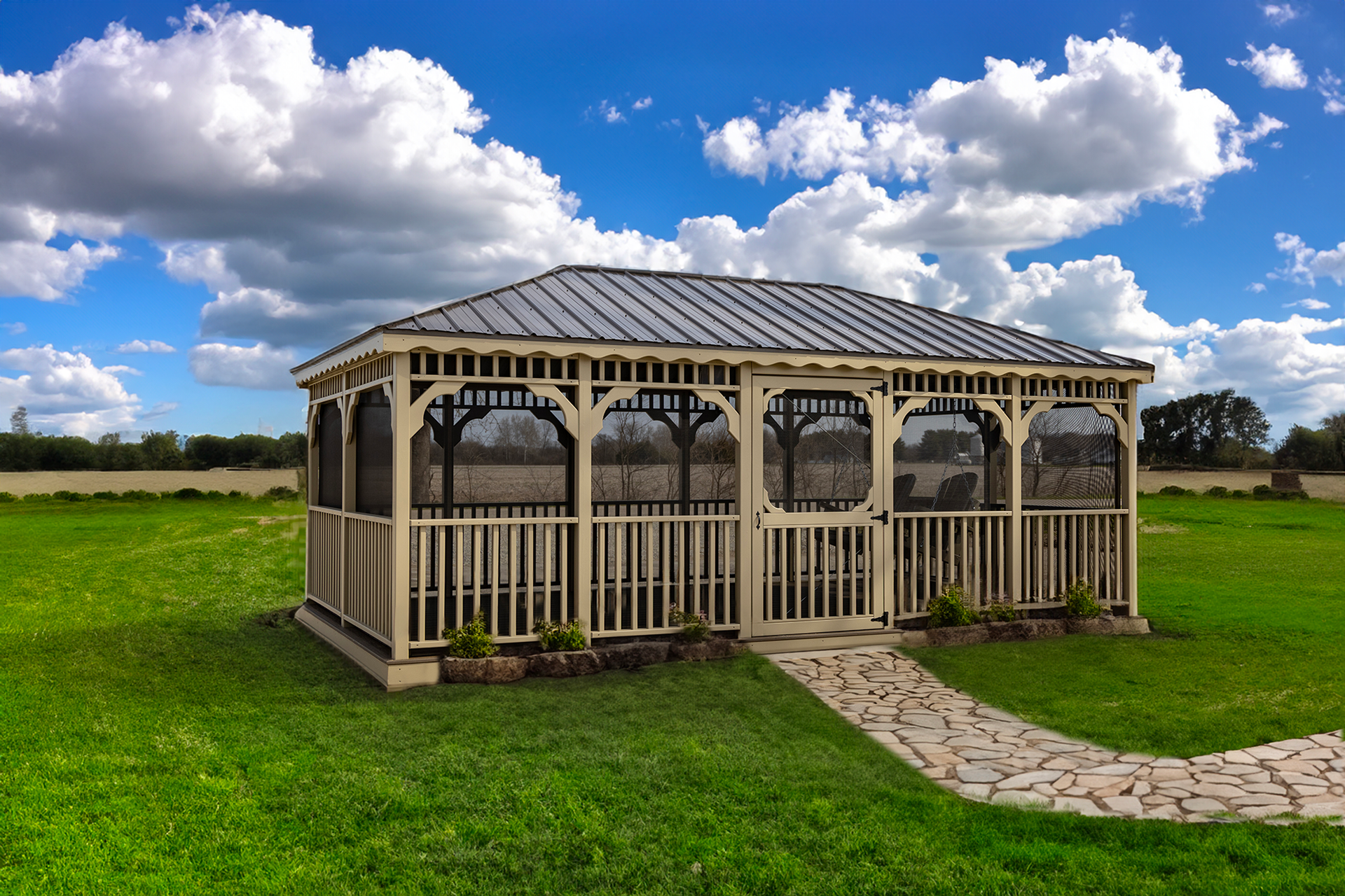 A gazebo is sitting in the middle of a lush green field.