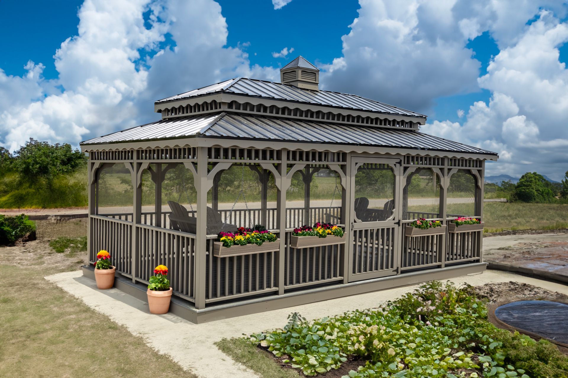 A gazebo with flowers in pots on the side of it