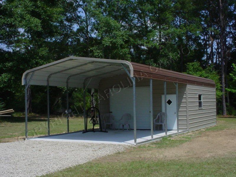 A carport with a brown roof and a white door