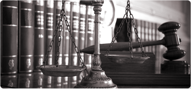 Scale, gavel and books on the table
