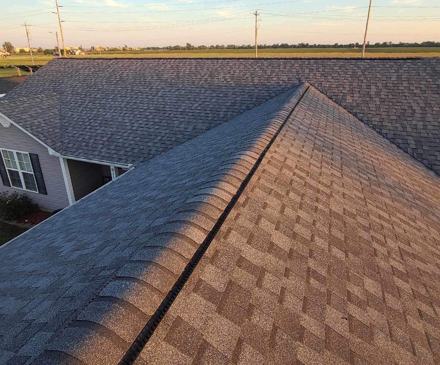 The roof of a house with a lot of shingles on it.