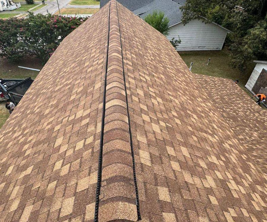An aerial view of a roof with shingles on it.