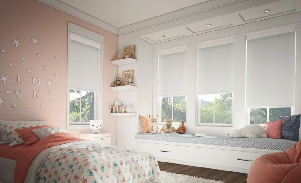 A bedroom with a bed , window seat , and a bean bag chair.