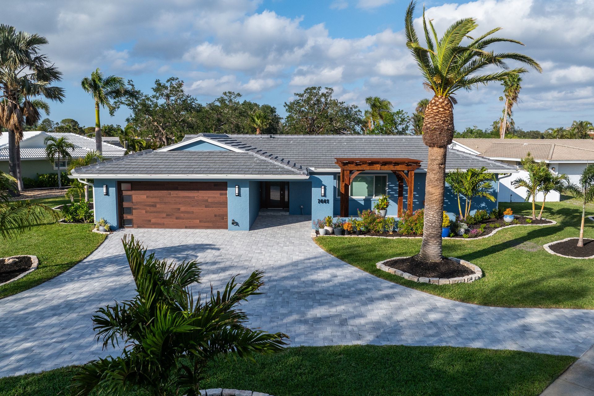 A house with a palm tree in front of it