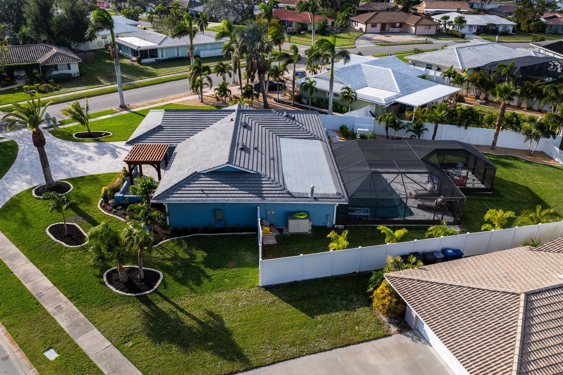 An aerial view of a house in a residential area