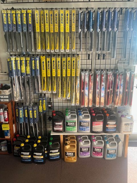 A store filled with lots of wiper blades and bottles of oil.