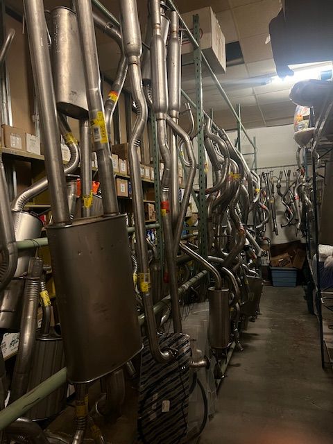A warehouse filled with a lot of exhaust pipes.