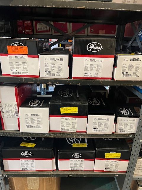 A shelf filled with boxes of parts in a store.