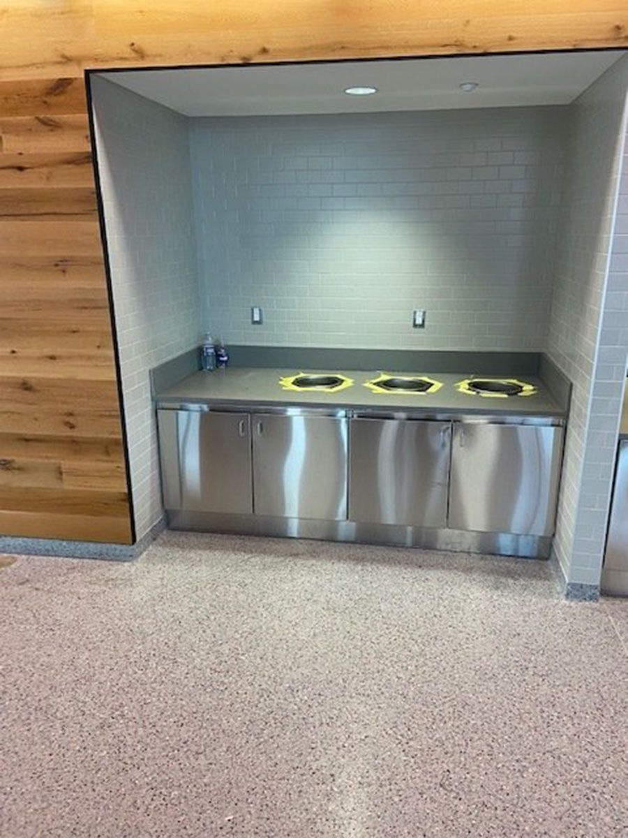 A kitchen with stainless steel cabinets